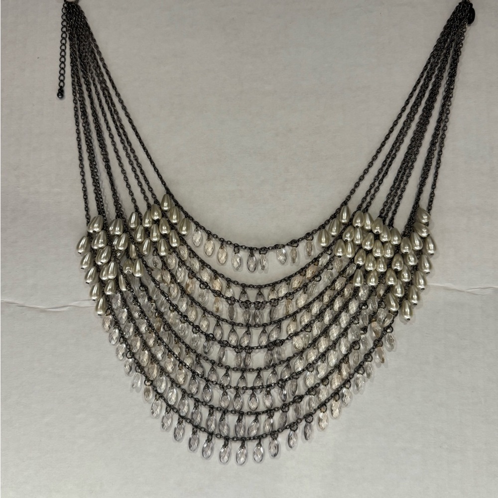 Breathtaking waterfall of silver + white droplet beads. Drapes beautifully. New!